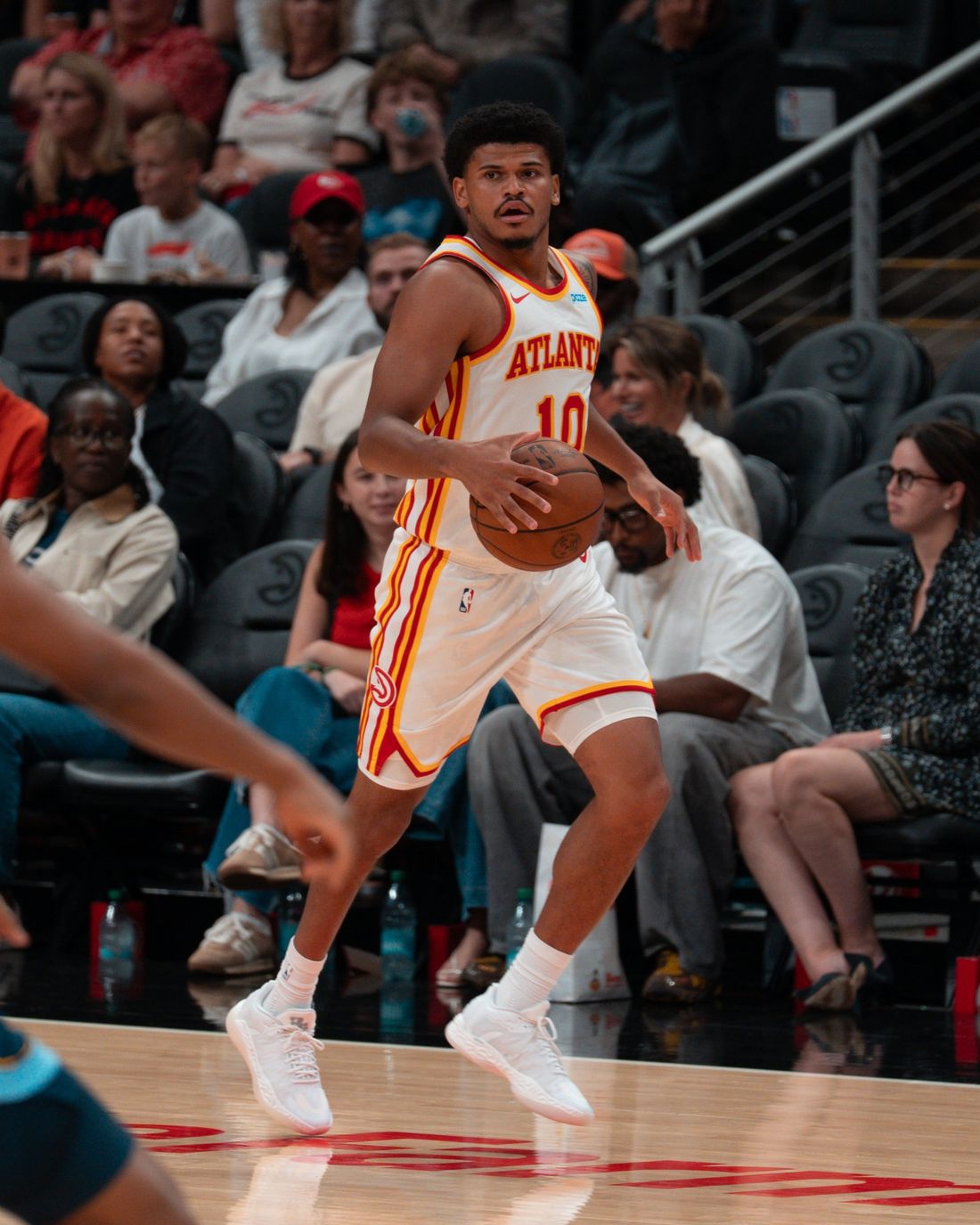 RayJ Dennis bringing the ball up court for the Atlanta Hawks